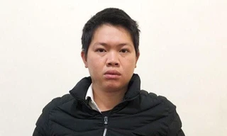 Đối tượng La Đức Quang tại cơ quan công an -Ảnh: H.T