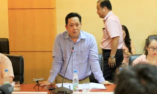 Ông Nguyễn Xuân Quang trả lời báo chí. Ảnh: Trường Phong