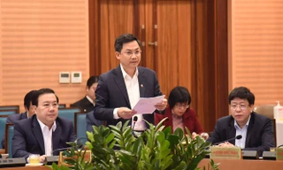 Phó Chủ tịch UBND thành phố Hà Nội Hà Minh Hải báo cáo tại hội nghị