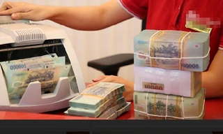 Nhiều chi nhánh chưa cho khách hàng vay ngân hàng này trả nợ ngân hàng khác. Ảnh: Như Ý