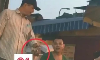 Bảo kê tại chợ Long Biên. Ảnh: Clip VTV