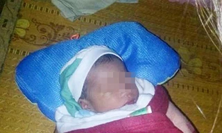 Bé trai sơ sinh bị bỏ rơi khi bão chuẩn bị đổ bộ