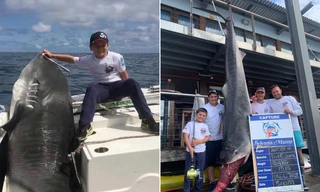 Jayden cùng con cá mập nặng hơn 3 tạ. Ảnh: NY Post