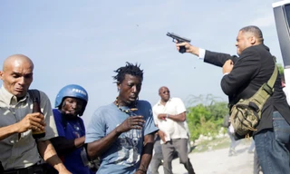 Ông Jean Marie Ralph Fethiere nã súng ngay khi bước xuống xe. Ảnh: Reuters