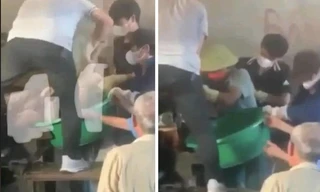 Hình ảnh người dân lấy thi thể người đàn ông ra khỏi máy xay