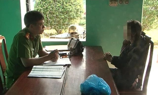 Công an lấy lời khai đối với T. 