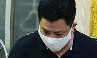 Phạm Phi Long tại cơ quan công an, ảnh: công an cung cấp.