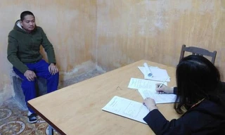 Bị can Hoàng Đức Trưởng tại cơ quan công an.