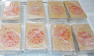 Phá đường dây mua bán ma túy ở TPHCM, thu giữ 8 bánh heroin 