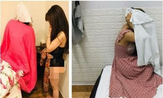 Hai cô gái bán dâm trong nhà nghỉ bị công an bắt quả tang. 
