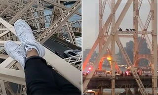 Thanh niên leo lên cột cầu cao chót vót làm loạn giờ tan tầm, hóa ra để quay livestream