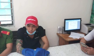 Đối tượng Nguyễn Thành Quang tại cơ quan điều tra. Ảnh: CACC