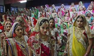 Các cô dâu xinh đẹp tại lễ cưới. Ảnh: AP.