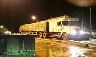 Xe đầu kéo 16N-1398 nhận 70 tấn xi măng tại Công ty xi măng Chinfon tối 4/8 để chở đi Quảng Ninh (ảnh to);	Các xe chở xi măng quá tải vô tư thoát qua chốt CSGT ở ngã 3 Đông Sơn (huyện Thủy Nguyên) ảnh cắt ra từ clip (ảnh nhỏ).