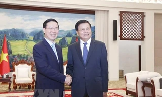 Tổng Bí thư, Chủ tịch nước Lào Thongloun Sisoulith tiếp ông Võ Văn Thưởng, Ủy viên Bộ Chính trị, Thường trực Ban Bí thư (Chiều 17/7). (Ảnh: Phạm Kiên/TTXVN)