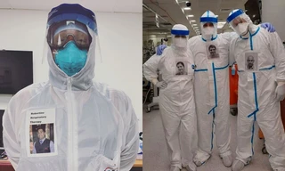 Bác sĩ dán ảnh tươi cười lên trang phục bảo hộ để truyền năng lượng tích cực cho bệnh nhân