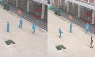 Giây phút thư giãn hiếm hoi: Nhân viên chống dịch mặc nguyên đồ bảo hộ chơi đá cầu