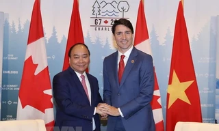 Thủ tướng Nguyễn Xuân Phúc và Thủ tướng Canada Justin Trudeau. Ảnh: Thống Nhất/TTXVN.