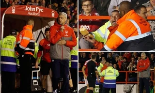 CĐV bị giữ lại vì mang bánh bao xuống sân mời HLV Wenger ăn.