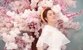 Lý Nhã Kỳ hoá nàng Xuân xinh đẹp đầu năm với áo dài, khăn đóng