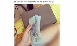 Hình ảnh khoe tiền khi đang ngồi trên giường trong trang phục mát mẻ của cô gái trẻ khiến cô chịu tiếng xấu. 