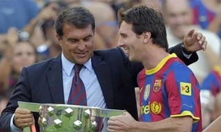 Laporta và Messi khi còn cùng làm việc chung tại Barca. Ảnh: Reuters