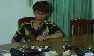 Quý tại cơ quan công an. 