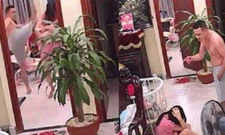 Hình ảnh người chồng đánh vợ mới sinh tại phường Thạch Bàn, quận Long Biên (Ảnh cắt từ clip)