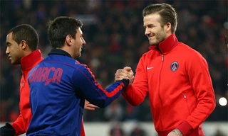 Messi đấu với Beckham trong trận PSG - Barca năm 2013. Ảnh: Reuters
