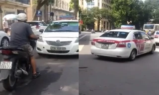 Chạy ngược chiều, taxi bị SH ép đi lùi hàng chục mét