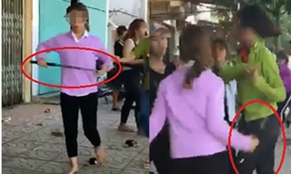 Nhóm nữ sinh cầm gậy sắt đánh nhau. Ảnh cắt từ clip