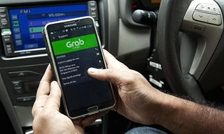 Grab sẽ "một mình một ngựa" khi không còn đối thủ trực tiếp Uber. Ảnh: CNBC.