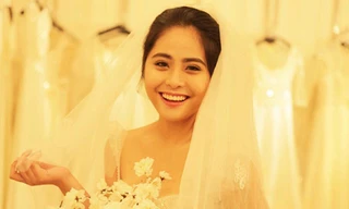 Kiều Anh úp mở việc sẽ lên xe hoa khi đăng tải bức ảnh mặc váy cưới với lời chú thích 'Đố các bạn biết thật hay đùa'.