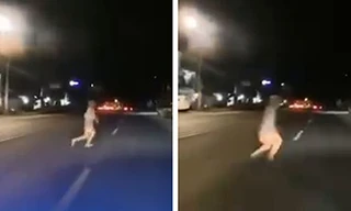 "Cái bóng trắng" lướt xuyên qua xe của người đi đường được camera ghi lại