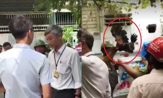 Đoàn kiểm tra của phường 15 xuống bắt gà. Ảnh cắt từ clip.
