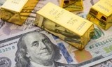 Giá vàng giảm mạnh, USD vẫn 'căng'