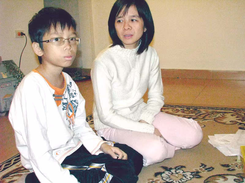 Mẹ và Tít Ảnh: Tr.T