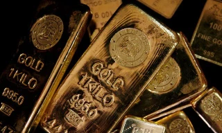 Giá vàng tăng nhẹ, USD đảo chiều 