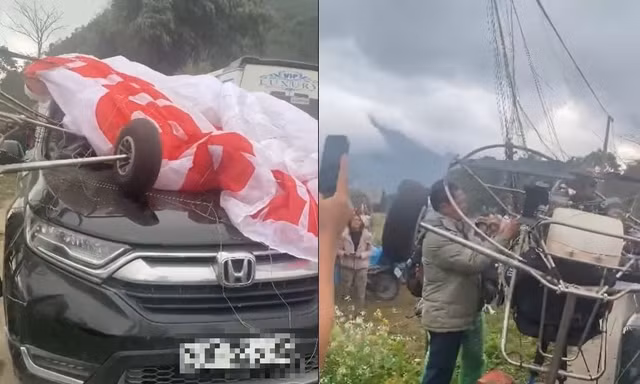 Dù lượn rơi vướng dây cáp rồi va chạm ô tô lưu thông trên đường ở Tuyên Quang