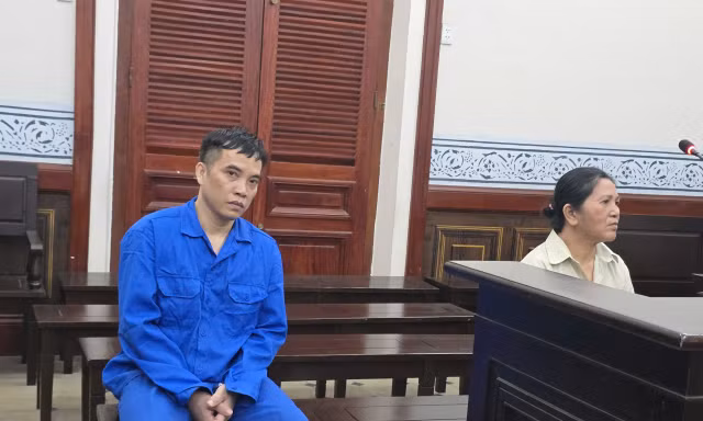 Hai bị cáo Long, Loan tại phiên tòa.