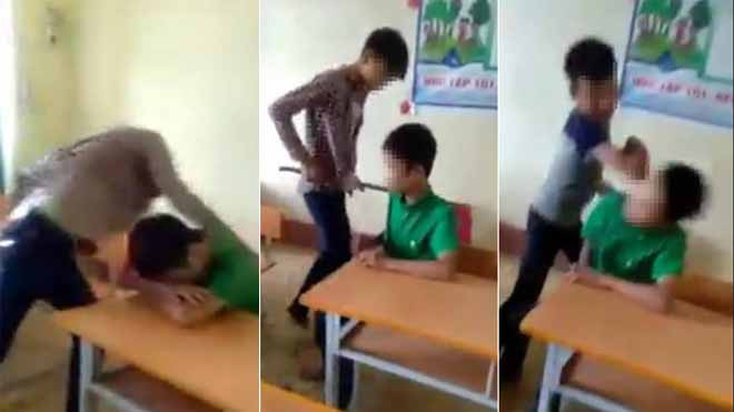 Nam sinh áo xanh chỉ biết ngồi im chịu trận.