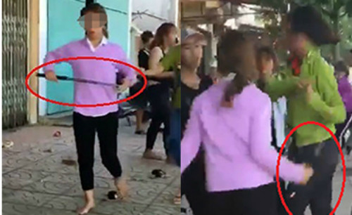 Nhóm nữ sinh cầm gậy sắt đánh nhau. Ảnh cắt từ clip