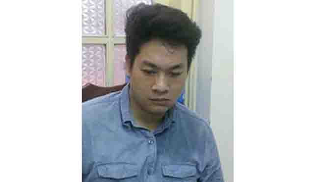 Tuấn tại trụ sở công an. Ảnh: Kiều Tâm.