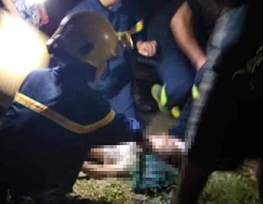 Người vợ được tìm thấy nằm bất tỉnh gần bể nước với nhiều vết thương trên người - Ảnh: NT