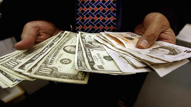 Một số ngân hàng gồm Citibank và National Australia Bank dự báo tỷ giá đồng USD chỉ tăng khoảng 5% trong năm 2016, so với mức dự báo tăng 10% mà Deutsche Bank đưa ra - Ảnh: Getty/CNBC.