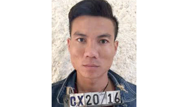 Hoan tại cơ quan điều tra. Ảnh: C.A