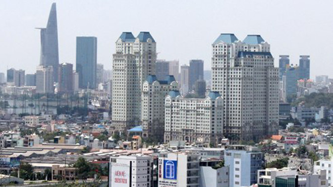 Theo các chuyên gia, sự hỗ trợ tích cực từ hàng loạt các chính sách mới sắp có hiệu lực vào năm 2015 sẽ góp phần tháo gỡ khó khăn và vướng mắc tâm lý cho thị trường bất động sản. Ảnh: Vũ Lê/ VnExpress