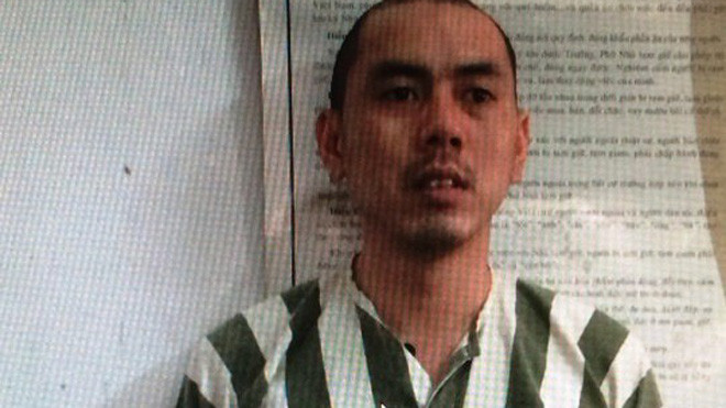 Nguyễn Văn Thành đang bị công an bắt giữ. 