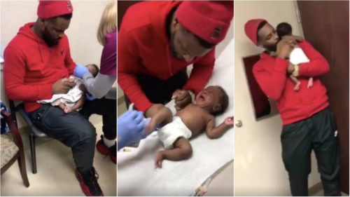 Antwon dỗ dành, ôm ấp con suốt thời gian bé đi tiêm. Ảnh: Facebook.