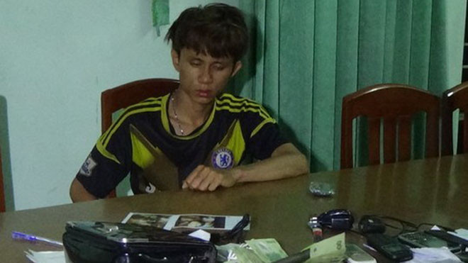 Quý tại cơ quan công an. 